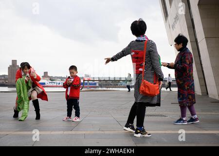 22nd September 2018. Japanese tourists enjoy the newly-developed Liverpool waterfront today. Stock Photo