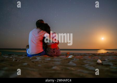 Silhouette of couple under full moon. Valentine day concept Stock Photo ...