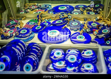 An abundance of evil eyes in the bazaar, vibrant talismans of Turkish cultural heritage, displayed as protective charms with mystical symbolism. Stock Photo