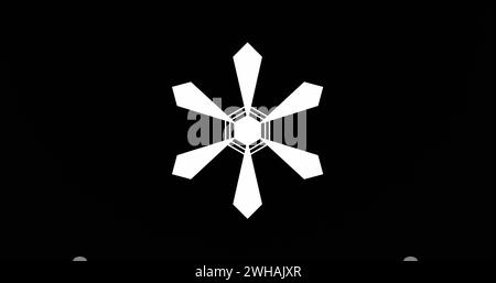A white geometric snowflake design stands out against a black background Stock Photo