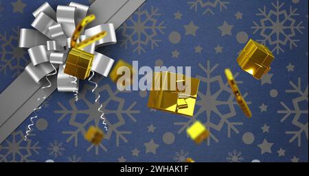 Image of candy canes and gifts christmas decorations on blue background Stock Photo