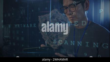 Image of data processing over asian male worker in server room Stock Photo