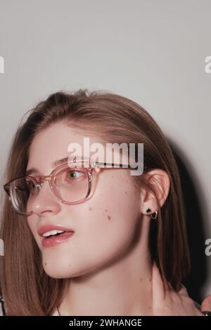 Photo of pretty charming young woman wearing glasses Stock Photo