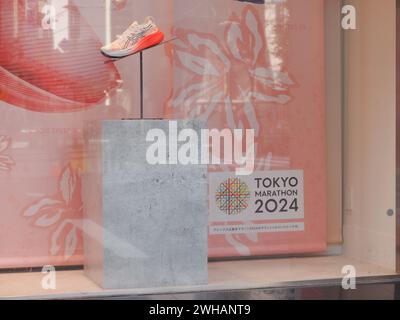 TOKYO, JAPAN - February 6, 2024: Special Tokyo Marathon 2024 Asics running shoes in displayed in the window of an Asics store. Stock Photo
