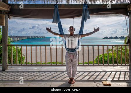 Maldives aero yoga class in the Six Senses Laamu maldives luxury resort villas, Laamu Atoll region Maldives Stock Photo
