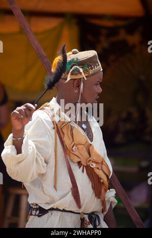 Man wearing renaissance costume holding feather vertical Stock Photo