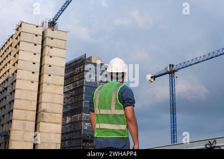 Engineer man working and looking construction site Stock Photo