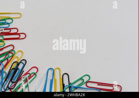 top view of colorful paper clips on white background Stock Photo