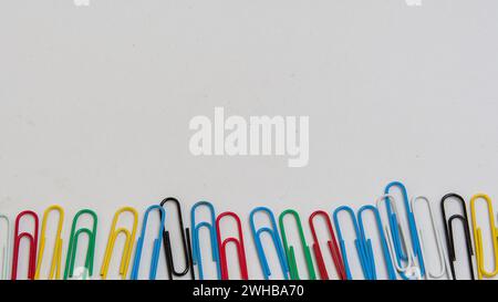 top view of colorful paper clips on white background Stock Photo