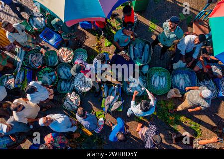 Aerial view of people working and trading at fish market along Karnaphuli river, Chittagong, Bangladesh. Stock Photo