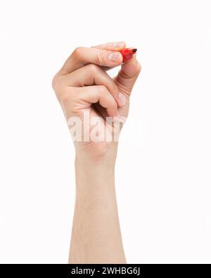 Man hand drawing in the air with a red marker on a white isolated background Stock Photo