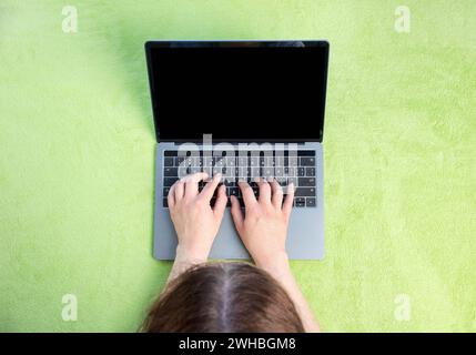 Top view of a woman working with laptop at home Stock Photo