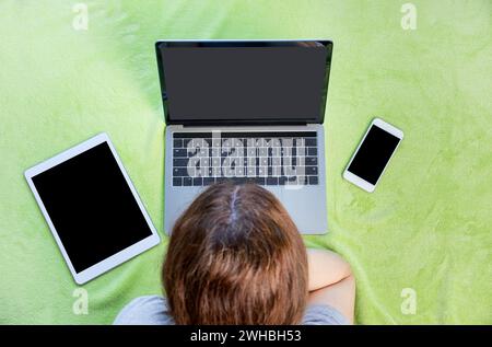 Top view of a woman using a laptop at home Stock Photo