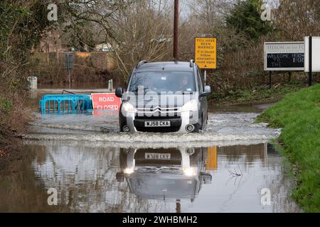 Charvil, Berkshire, UK. 9th February, 2024. The Charvil Ford in Charvil, Berkshire is closed today due to flooding after heavy rain yesterday. Credit: Maureen McLean/Alamy Live News Stock Photo