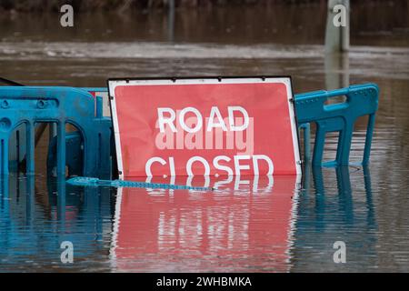 Charvil, Berkshire, UK. 9th February, 2024. The Charvil Ford in Charvil, Berkshire is closed today due to flooding after heavy rain yesterday. Credit: Maureen McLean/Alamy Live News Stock Photo