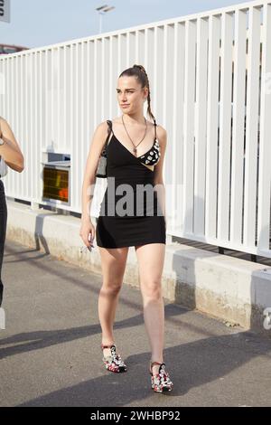 MILAN, ITALY - JUNE 17, 2022: Clara Soccini with black dress and shoes with transparent gems decoration before Dsquared2 fashion show, Milan Stock Photo
