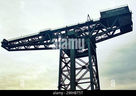 Glasgow, Scotland, UK. 9tht February, 2024.  The Finnieston Crane is a giant cantilever crane Cloudy riverside and Dancing wave the longest mural in the city celebrates the heritage of the river clyde and runs along its bank illustrating its sites and history where the clyde titan crane at finneston near the bbc  dominates the bank. Credit Gerard Ferry/Alamy Live News Stock Photo