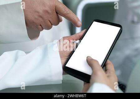 Doctors are pointing on smartphone Stock Photo