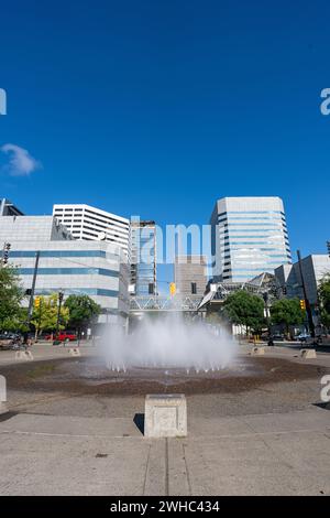 A wide-angle photo of Salmon Street Springs Fountain at Tom McCall Waterfront Park in Portland Oregon on a clear summer day. Stock Photo