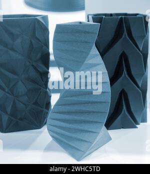 Art object vase printed on a 3D printer. Models created by a 3D printer from blue molten plastic. Concept 3d printing. Additive progressive technologies. New modern technology for creating objects Stock Photo