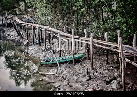 Old row boat in mud Stock Photo - Alamy