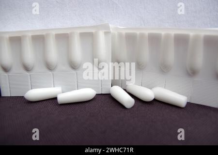 Suppositories, production, plastic, suppositories, pharmacy, moulds, The suppository mass is filled into disposable moulds to produce the Stock Photo