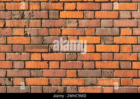 Background of red brick wall in the old town. Stock Photo
