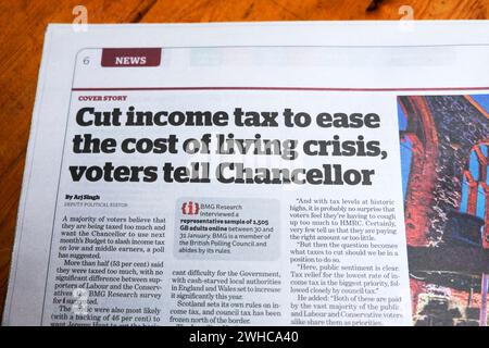 'Cut income tax to ease the cost of living crisis voters tell Chancellor' Jeremy Hunt i newspaper headline budget article 6 February 2024 London UK Stock Photo