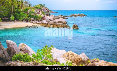 Costline of Koh Tao Islands in Thailand. Granite Rocks and blue lagoon with clear sea water. Stock Photo