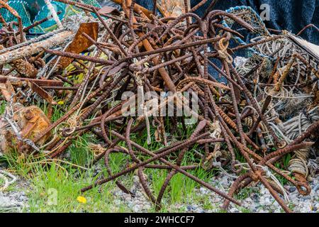Closeup of large rusty iron grappling hooks used in fishing industry in South Korea Stock Photo