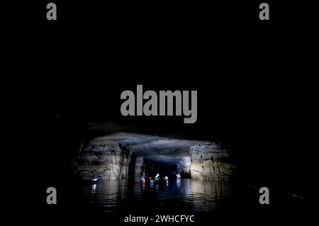 Kayaking a abandoned silica mine that is flooded with water. Stock Photo