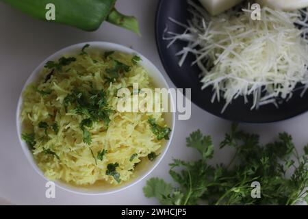 Spiced papaya rice. A quick stir fried rice recipe with green papaya, turmeric and a tadka of spices and nuts to make a one pot meal. Ideal for topics Stock Photo