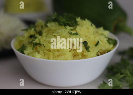 Spiced papaya rice. A quick stir fried rice recipe with green papaya, turmeric and a tadka of spices and nuts to make a one pot meal. Ideal for topics Stock Photo