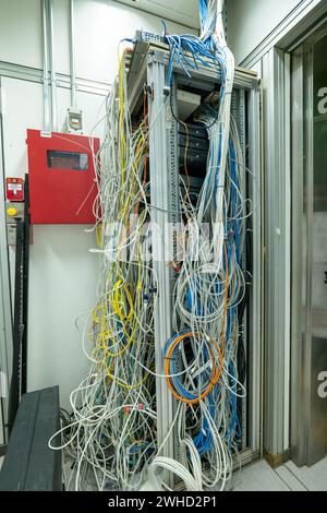 Server Room Labyrinth A Tangle of Wires and Technology Stock Photo