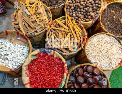 A bird's-eye view of sacks with various colorful spices and herbs for sale at a market in Fort Kochi, Cochin, Kerala, India Stock Photo