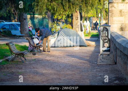 VALENCIA, SPAIN - FEBRUARY 2, 2024: Homeless person on street in Valencia, Spain on February 2, 2024 Stock Photo
