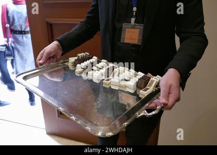 Distribution of chocolate after the Mass in honour of St. Maroun at the Maronite church of St. George, Beirut, Lebanon, February 9 2024. Maroun was a 4th-century Syriac Christian hermit whose followers, after his death, founded a religious movement later known as the Maronite Church, in full communion with the Catholic Church. In Lebanon February 9, St. Maroun Day, is a public holiday for christian people and institutions. Currently, the Maronite Patriarch of Antioch, i.e. the head of the Maronite Church, is Bechara Boutros Rai. (Photo by Elisa Gestri/Sipa USA) Stock Photo