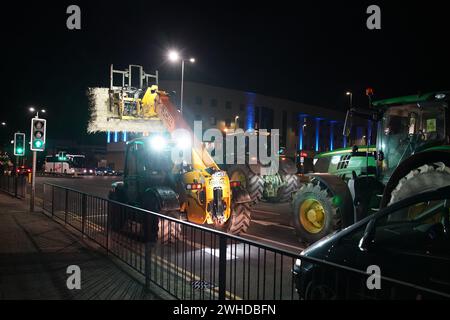 Farmers using their vehicles to cause disruption and slow traffic around the Port of Dover as they protest against cheap meat imports. Picture date: Friday February 9, 2024. Stock Photo