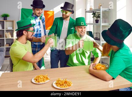having fun and drinking green beer together Stock Photo