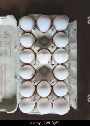 Fresh white eggs in egg carton Stock Photo