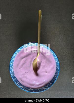 Dessert, bowl with quark, berry quark, blackberry flavor Stock Photo