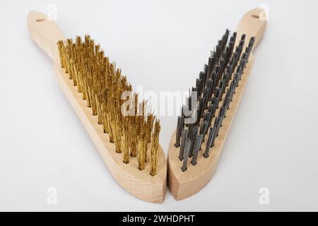 Two hand wire brushes with wooden handle, brass brush, steel brush, white background, Stock Photo