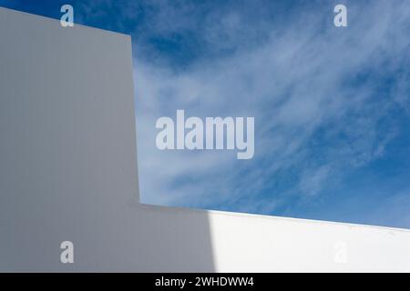blue sky and white wall with shadow Stock Photo