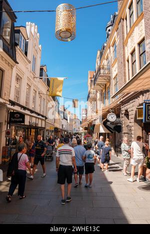 A Sunny Day Unfolds on a Busy Scandinavian Shopping Avenue Stock Photo