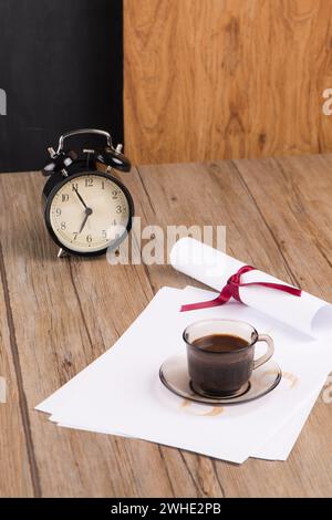 Old clock, hat, coffee and paper sheets Stock Photo
