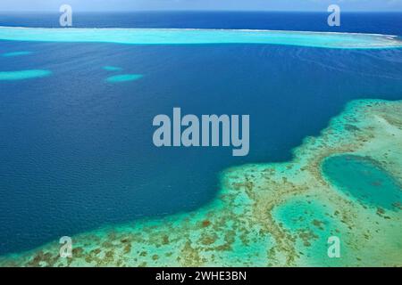 Aerial view of turquoise water and the coral reef in the South Pacific Ocean near the island of Raiatea on the south eastern coast of Raiatea Stock Photo