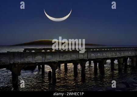 Large setting crescent moon  over Lanai Stock Photo