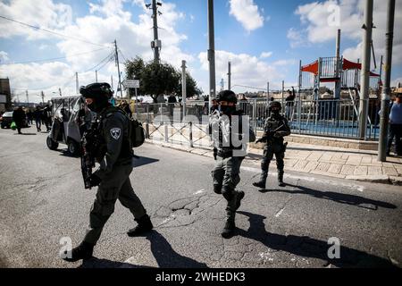 Jerusalem, Israel. 09th Feb, 2024. Members of the Israeli security forces seen walking on the street amid the the Friday noon prayer in the east Jerusalem neighbourhood of Ras al-Amud as age restrictions have been imposed to access the Al-Aqsa Mosque compound, amid the ongoing battles between Israel and the Palestinian group Hamas. Israeli forces take security measures as the Palestinians perform Friday prayers on a street at Ras Al-Amud neighborhood in Jerusalem. (Photo by Saeed Qaq/SOPA Images/Sipa USA) Credit: Sipa USA/Alamy Live News Stock Photo