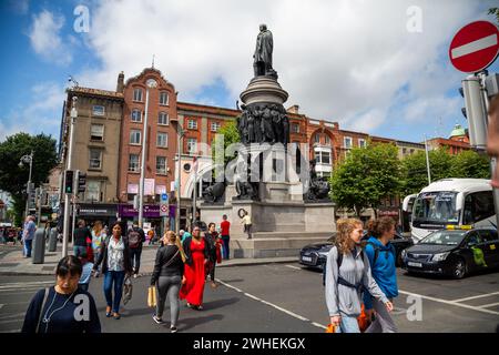 '11.07.2019, Ireland, County Dublin, Dublin - O Connell Street, Dublin's most famous street in the city, with monument to Daniel O Connell (founder of Stock Photo