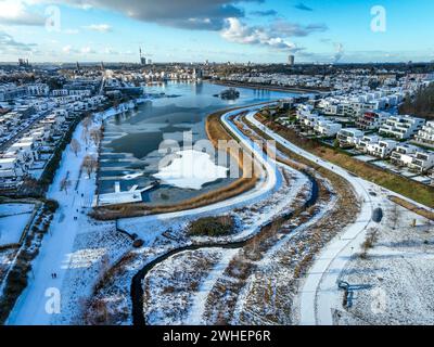 '18.01.2024, Germany, North Rhine-Westphalia, Dortmund - Phoenix Lake in winter with snow, in front the renaturalized Emscher. The river has been tran Stock Photo